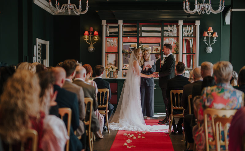 Bromley Court Hotel - A bride and groom exchange vows in a hotel wedding ceremony.
