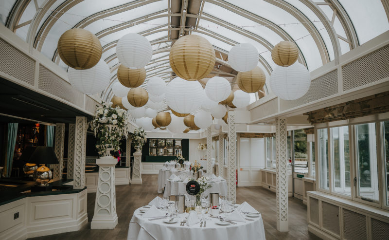 Bromley Court Hotel - A wedding reception at a charming restaurant in Bromley, adorned with delicate white paper lanterns.