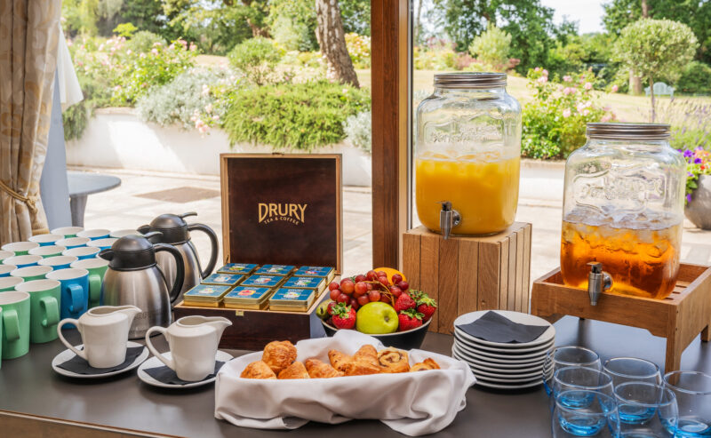 Bromley Court Hotel - A breakfast buffet with juices and pastries on a table, perfect for meetings.
