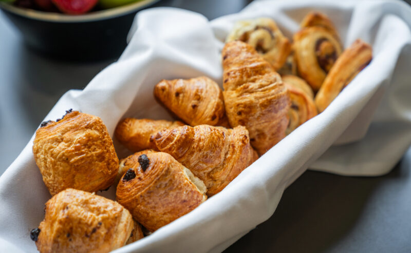 Bromley Court Hotel - A basket of croissants and pastries on a table during meetings.